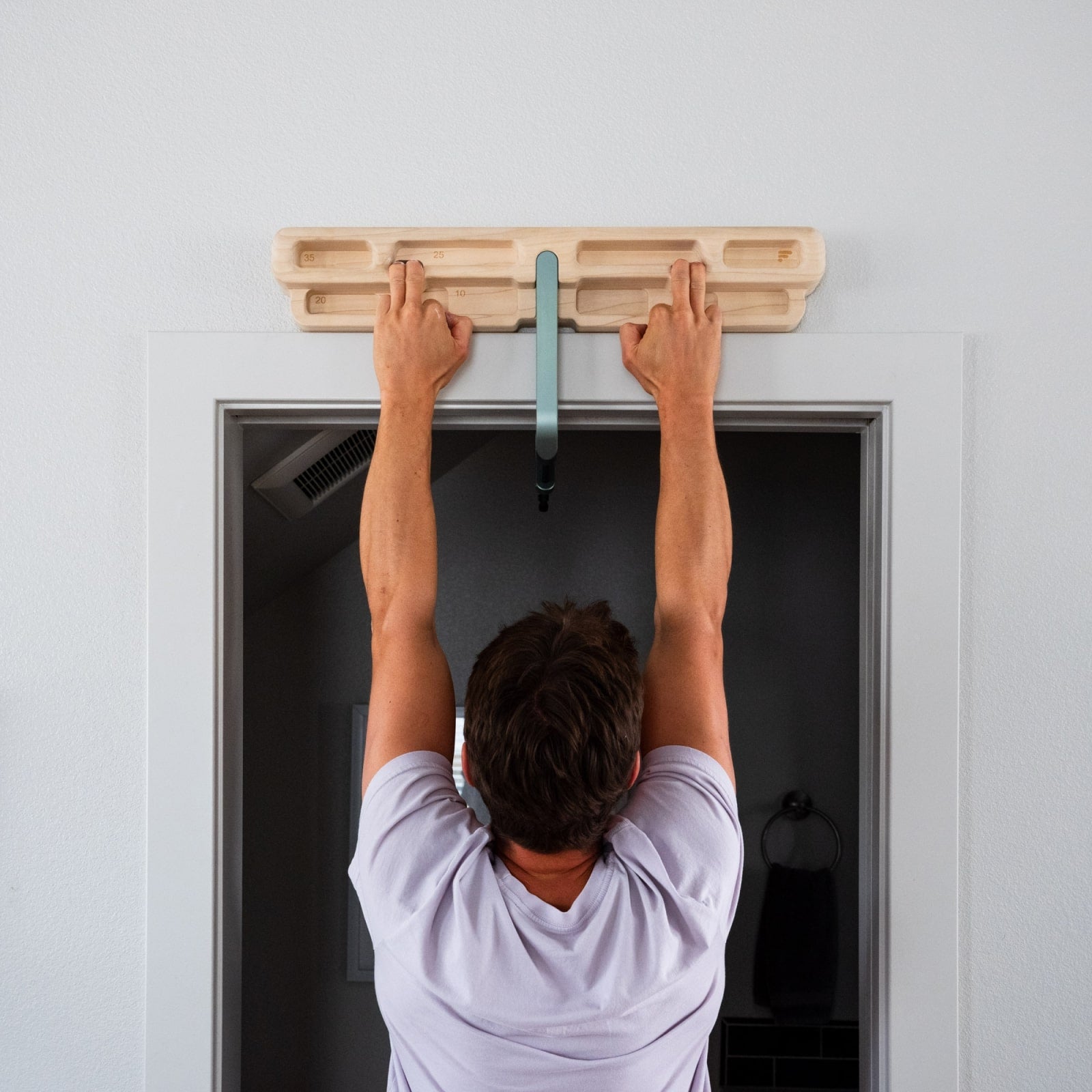 Person using the pockets on the DoorMount Pro
