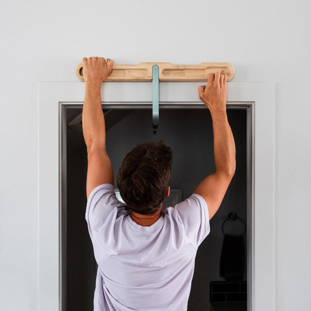 Person doing an exercise on the DoorMount Pro